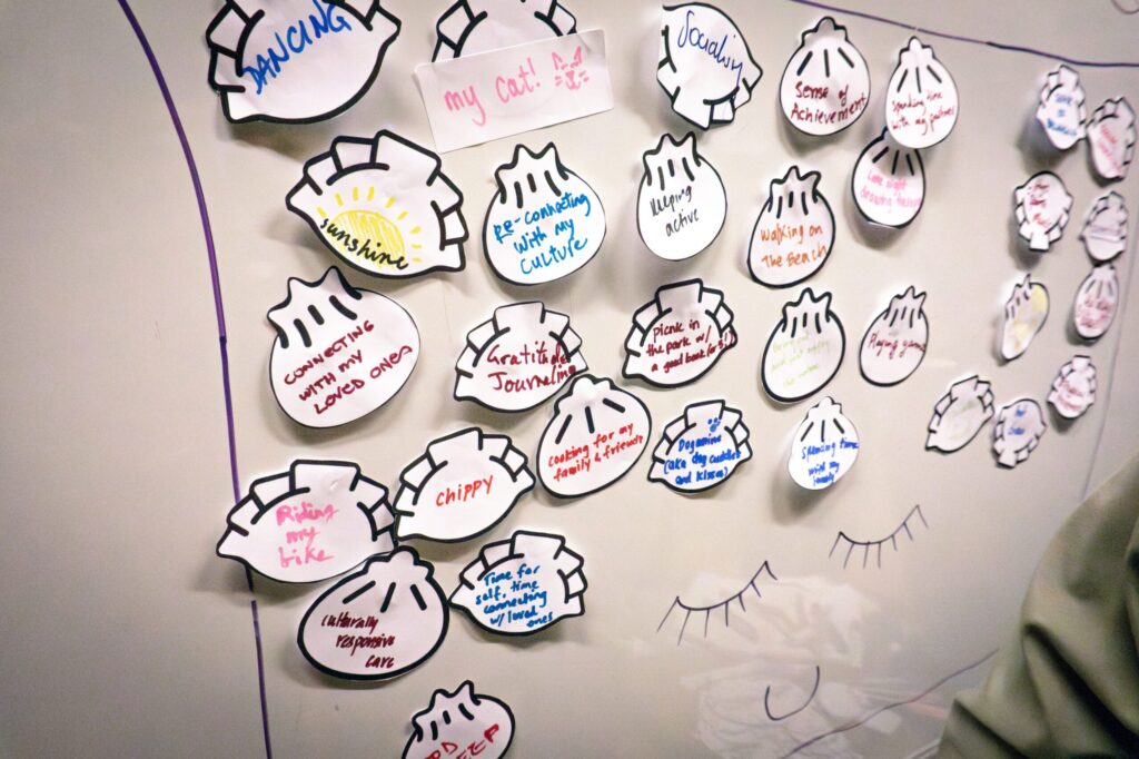Paper dumplings with handwritten messages of hope on a wall